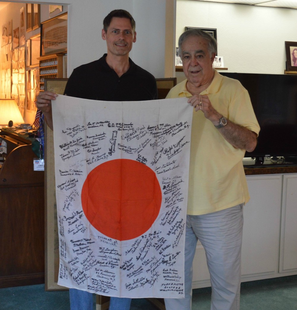 James Scotella & Brent Spencer holding captured Japanese Flag