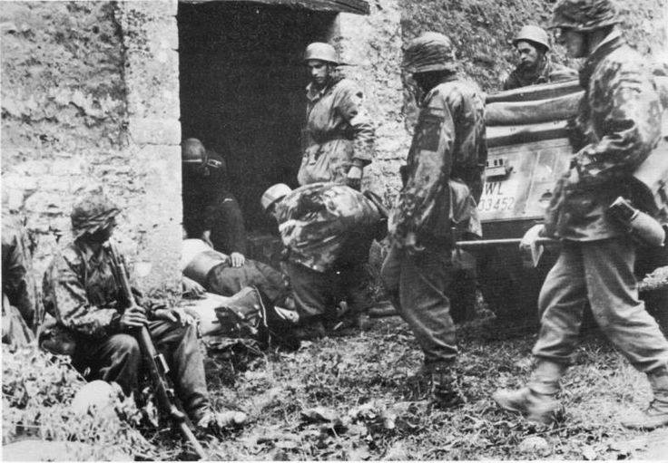 Soldier at left - Carentan 10th June 1944